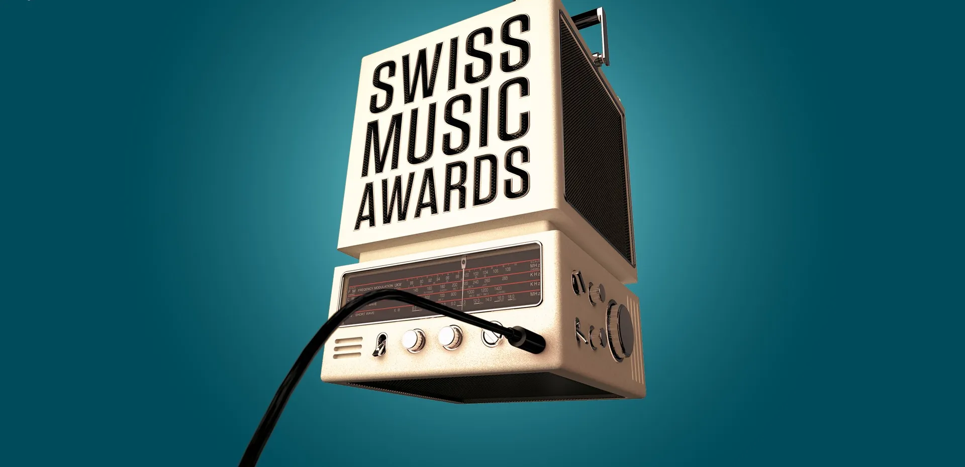 Une vieille radio avec une pancarte « Swiss Music Awards » sur fond turquoise